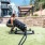 a woman exercising in a yard