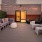 a large deck with chairs and couches