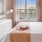 a bed and dresser in a bedroom