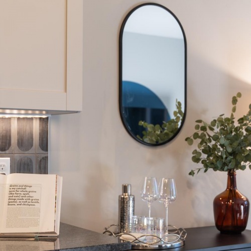 Find your perfect fit at Crescent at Chevy Chase a vase of flowers and glasses on a counter