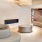 a room with white couches and a chandelier
