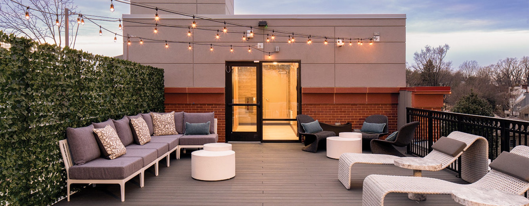 a roof deck with lounge seating