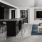 a lounge with a kitchen and a large couch