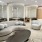 a room with a couch and chairs