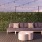 a couch and chairs on a deck