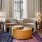 a room with a table chairs and a rug