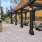 chairs and couches under a covered patio